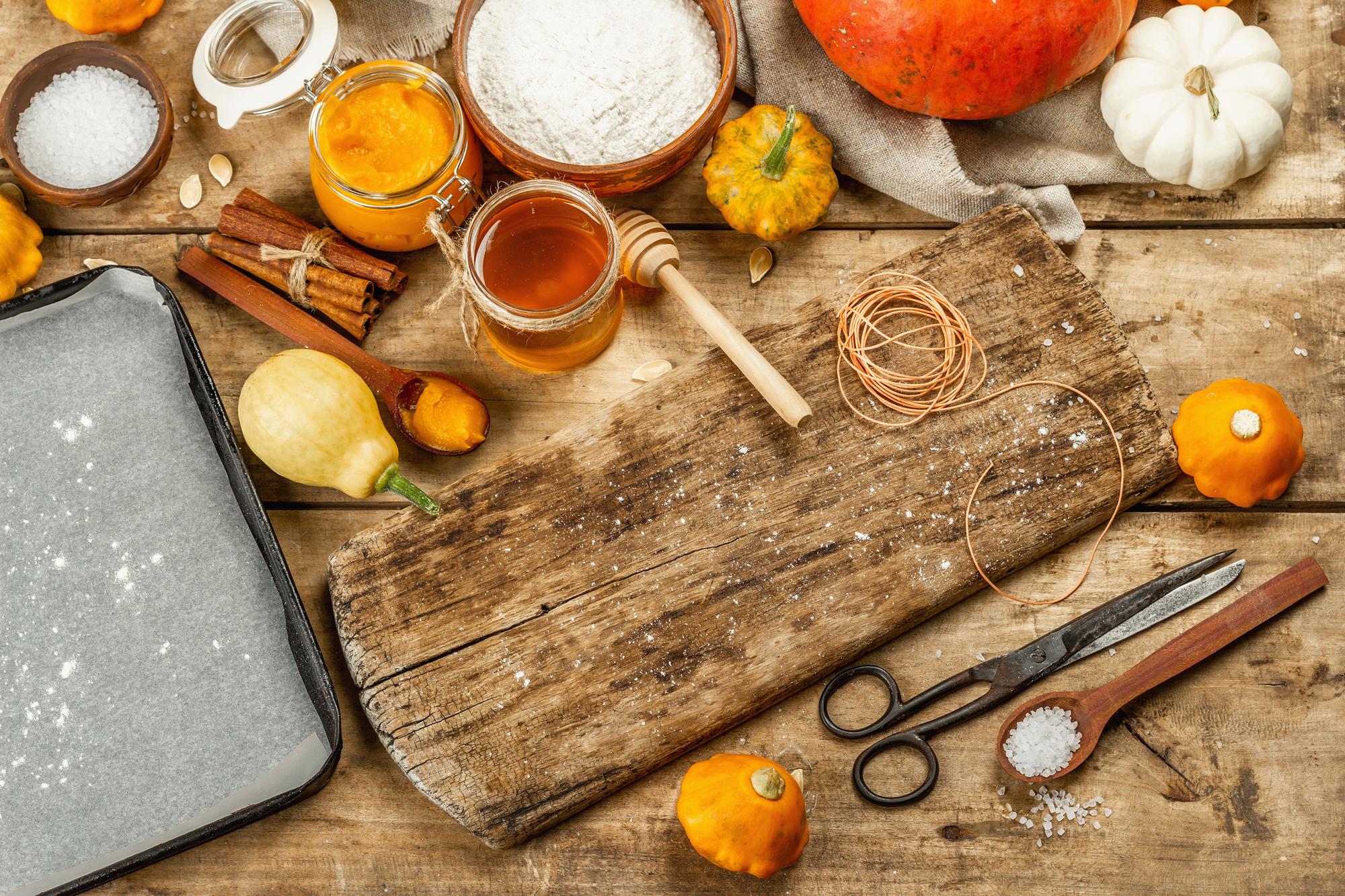 Artisanal kitchen workspace with hands arranging garnish